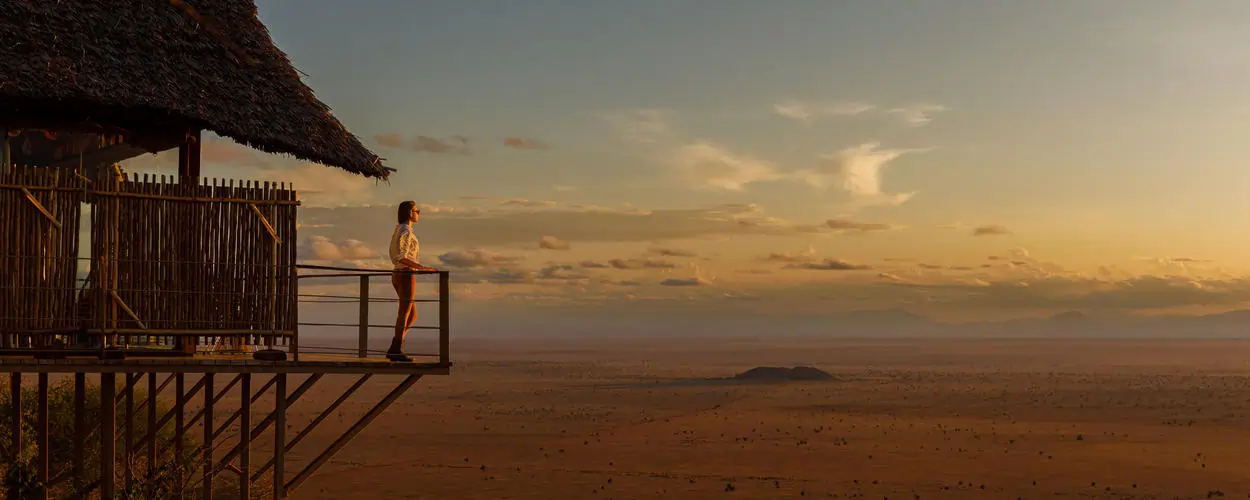 Soroi Lions Bluff Lodge perched on rocky bluff overlooking Tsavo with Mount Kilimanjaro views